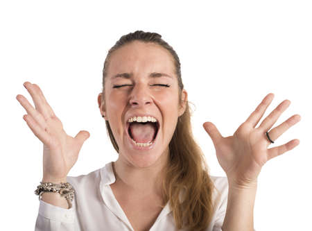 Desperate businesswoman stressed out from work screamsの写真素材