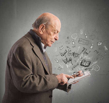 Aged send email and read with tabletの写真素材