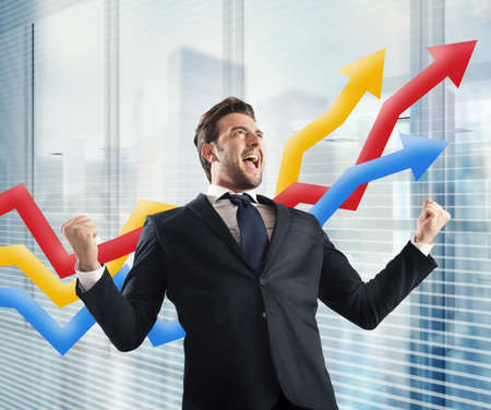 Businessman yells to delight of economic triumphの写真素材