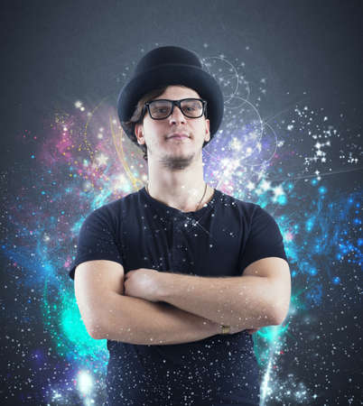 Boy charming magician with colored twinkling lightsの写真素材