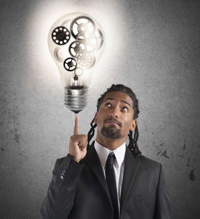 Businessman has a great idea with mechanismsの写真素材