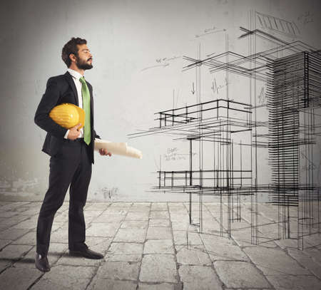 Young architect imagines his new construction projectの写真素材