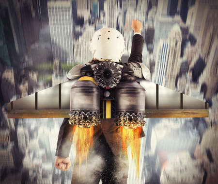 Man with helmet flies with powerful turbine