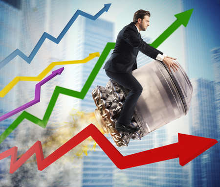 Businessman over missile into city between arrowsの写真素材