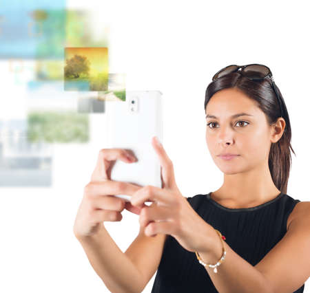 Girl makes pictures from her cell phoneの写真素材