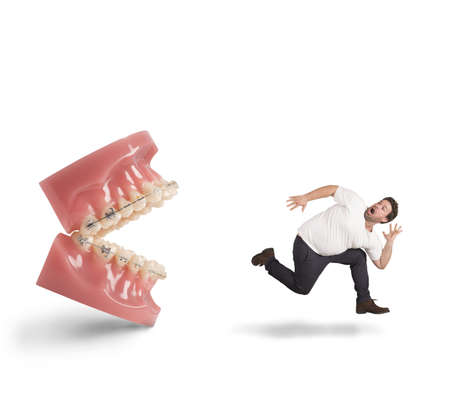 Man runs away for fear of dentistの写真素材
