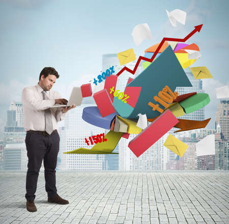 Businessman working at computer graphs and percentagesの写真素材