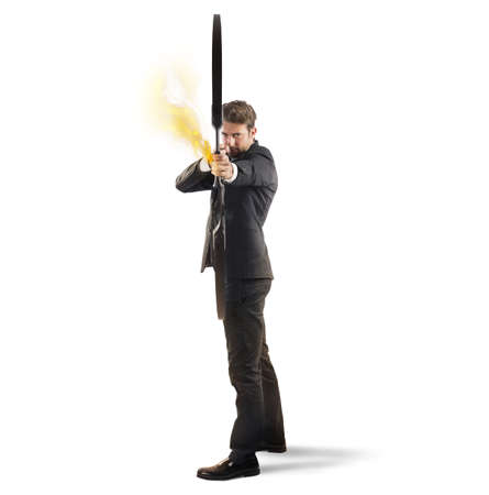 Businessman with bow and arrow on fireの写真素材