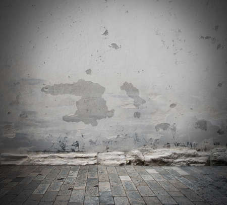 Background with grey damaged wall and floorの写真素材