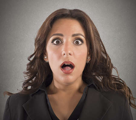 Portrait of business woman with astonished expressionの写真素材