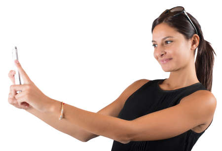 Girl with mobile phone likes to shootの写真素材