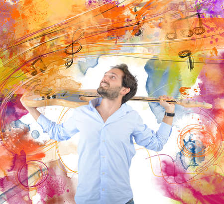 Young guitarist and his passion for musicの写真素材
