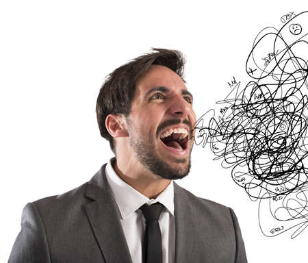 Stressed businessman stressed out from work screamsの写真素材