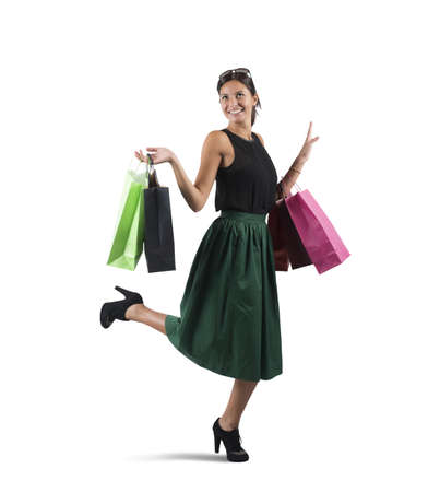 Shopaholic woman happy of her many purchasesの写真素材
