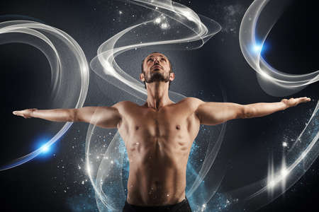 Man with perfect fit in shiny backgroundの写真素材