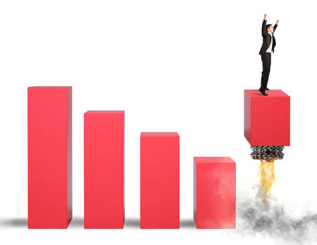 Businessman manages to rise to the topの写真素材