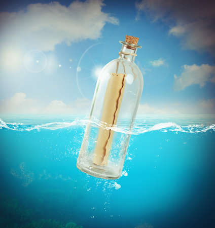 Letter in a bottle in the seaの写真素材