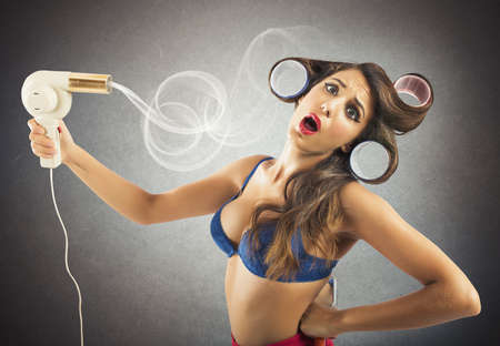 Brunette pin-up girl dries her long hair