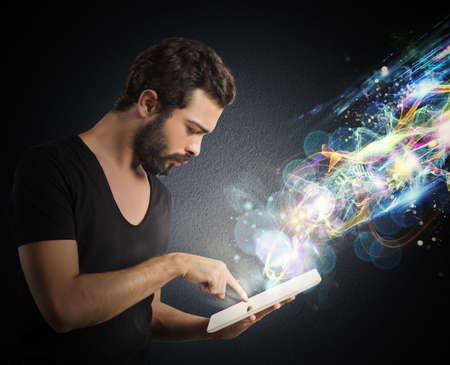 Boy with tablet that emits lighting effects