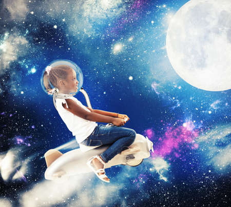 Little girl with toy airplane in spaceの写真素材