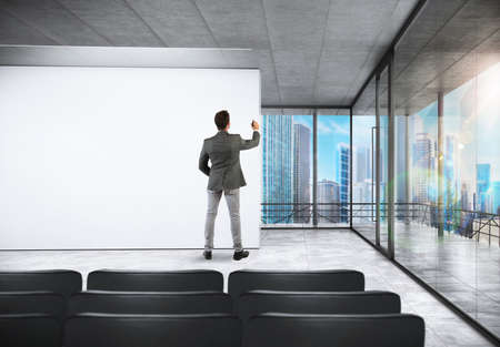 Successful businessman writing in the meeting roomの写真素材