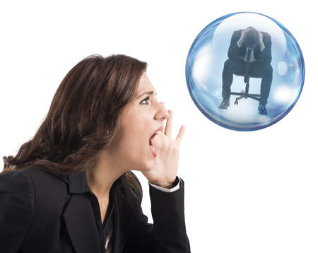 Woman yelling to man inside a bubbleの写真素材