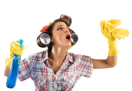 Vintage housewife cleans with spray and clothの写真素材