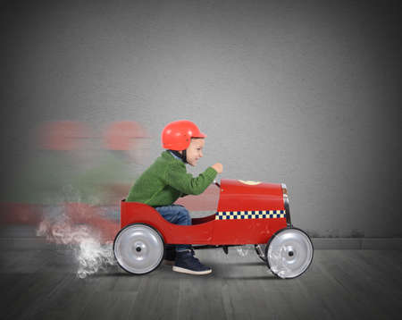 Child with helmet plays with the carの写真素材