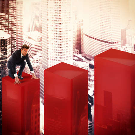 Determined businessman begins his climb of statisticの写真素材