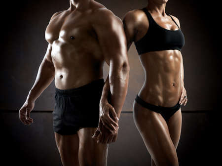 Couple man and woman muscled and bodybuilderの写真素材