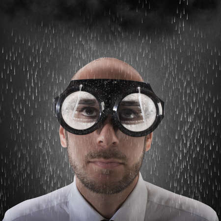 Businessman wearing glasses with wipers for snowの写真素材