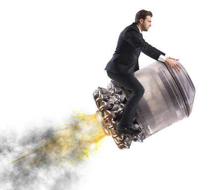 Determined businessman over a missile flying highの写真素材