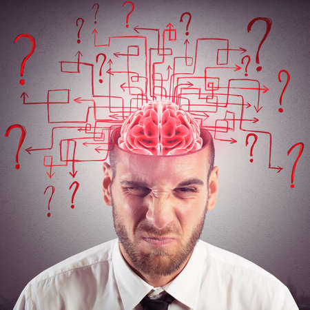 Brain of businessman with maze of questions