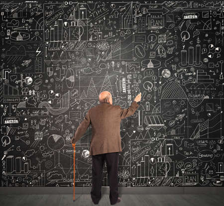 Genius business senior write on the blackboardの写真素材