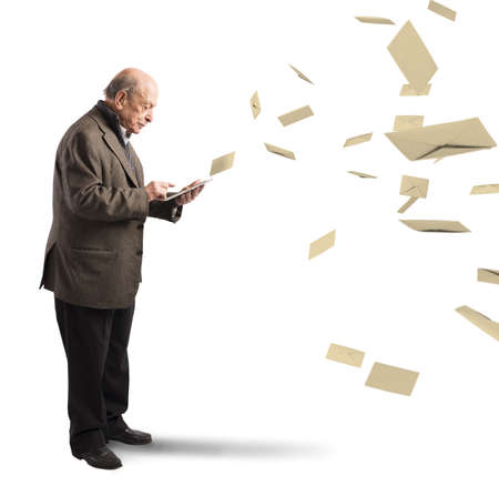 Old man send email from his tabletの写真素材