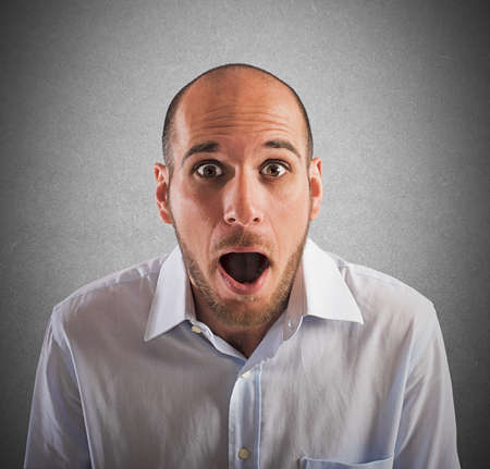 Man with astonished expression with mouth openの写真素材
