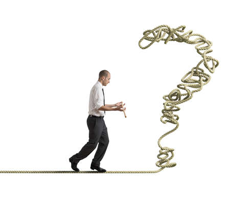 Businessman poised to solve a tangled problemの写真素材