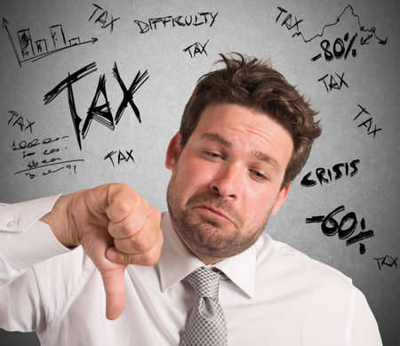 Businessman with negative expression for crisis taxesの写真素材