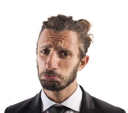 Portrait of sad businessman with sorrowful expression