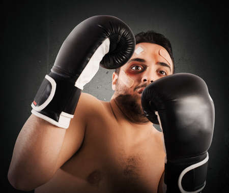 Frightened man boxer with plasters and bruises