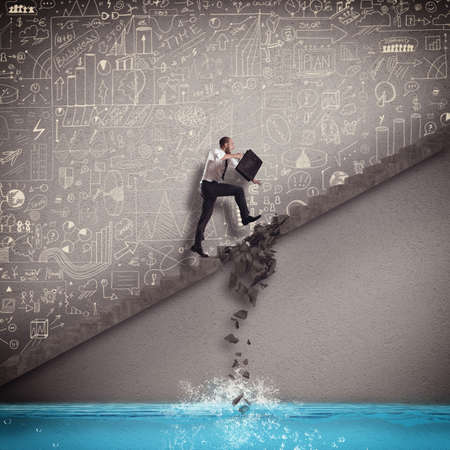 Businessman trying to overcome break step scaleの写真素材