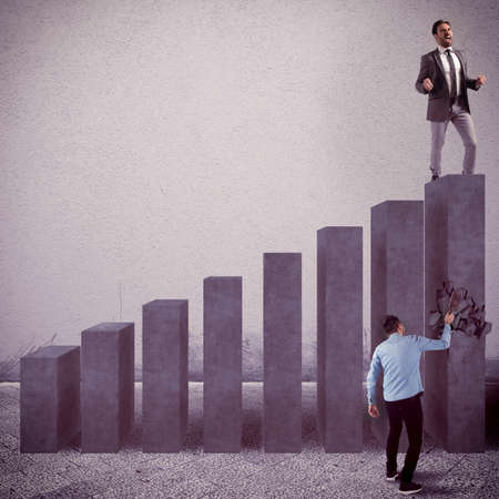 Angry man breaks a step of statisticの写真素材