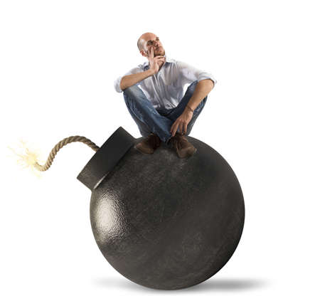Man thinking over bomb about to explodeの写真素材