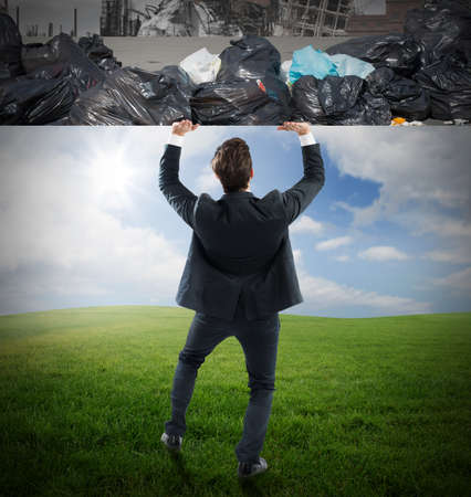 Man pushes the rubbish from clean natureの写真素材