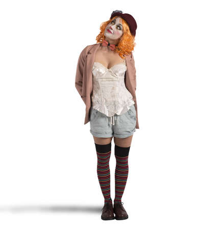 Woman extravagant clown extravagant with thoughtful expressionの写真素材
