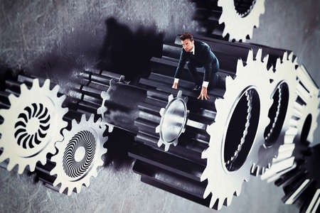 Man in a system of gear stuckの写真素材