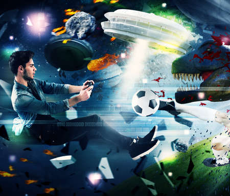 Teenager with joystick play with video gameの写真素材