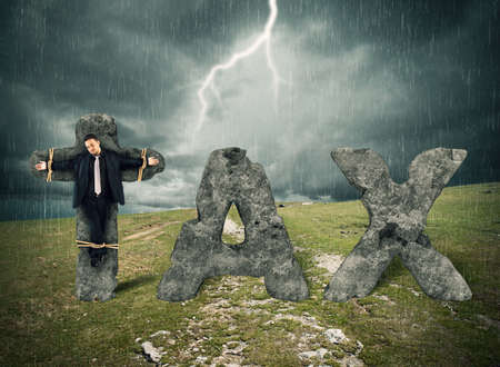 Crucified man on the stone during stormの写真素材