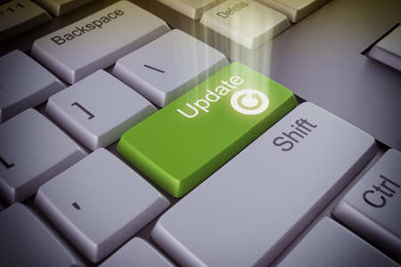 Computer keyboard with an update green keyの写真素材