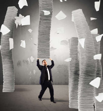 Man holding an infinite stack of sheetsの写真素材